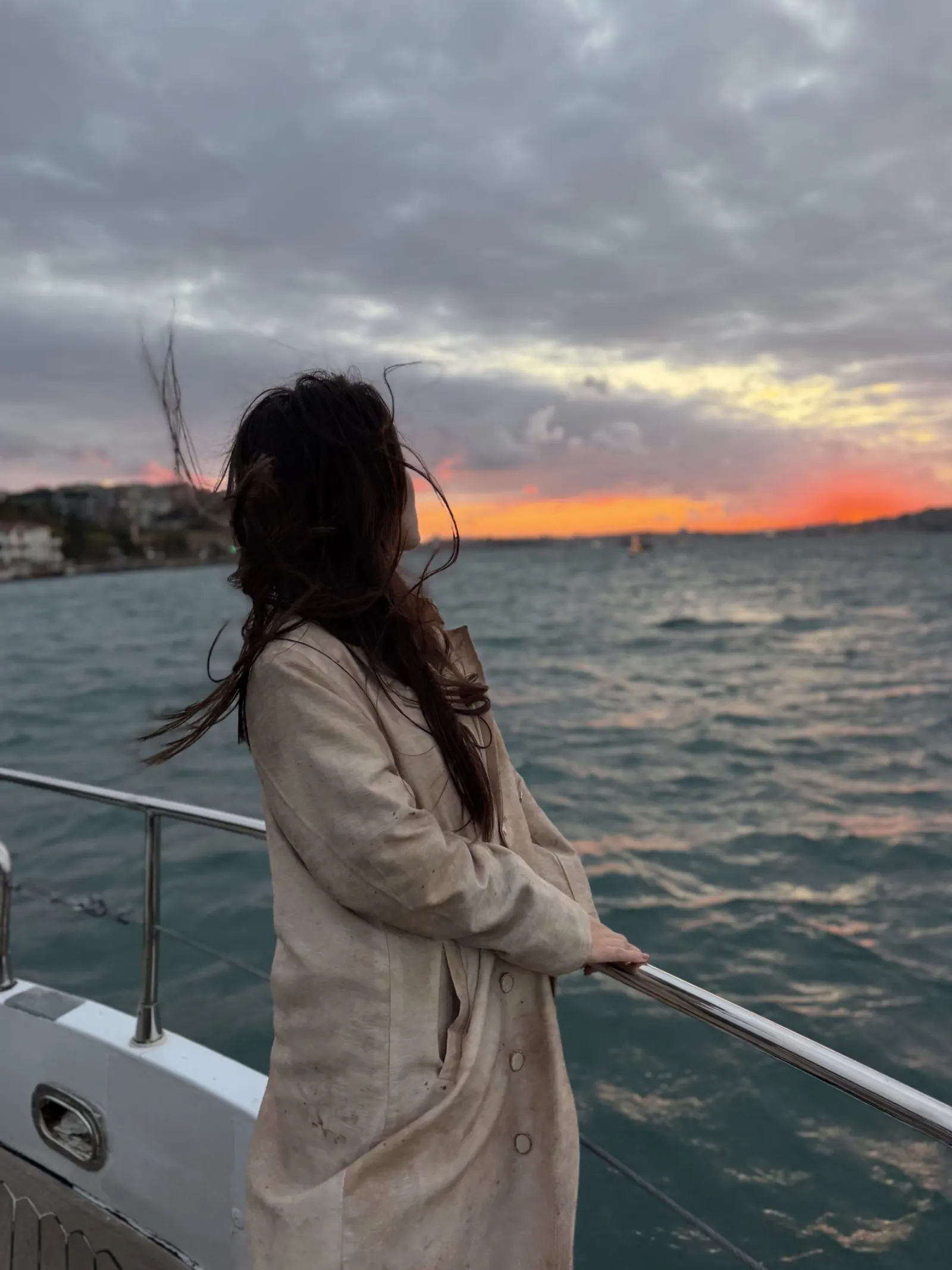 Private Bosphorus yacht with city lights in autumn evening
